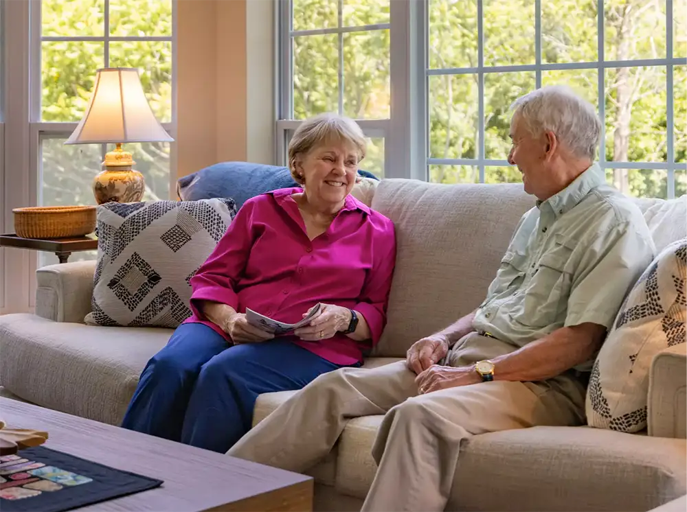 Expansion Ground Floor Senior couple sitting on a couch together